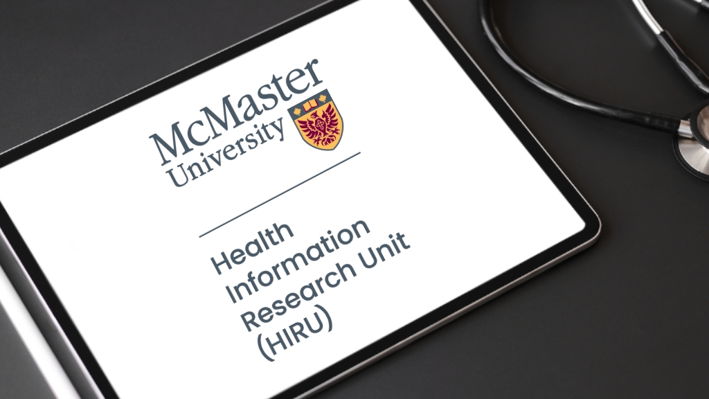 A desk with a tablet and a stethoscope. The tablet displays the logo for McMaster University's Health Information Research Unit.